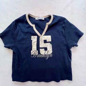 Primark‎ Blue Cropped Shirt with “15 Brooklyn“ on front,
Small